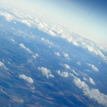 An aerial view of the Earth with clouds.