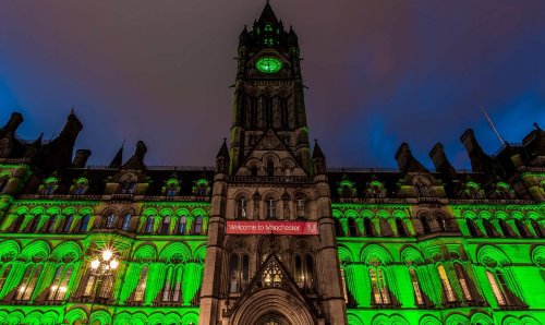 Manchester town hall lit up in green